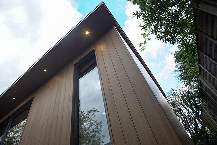 Stylish garden room with canopy lighting