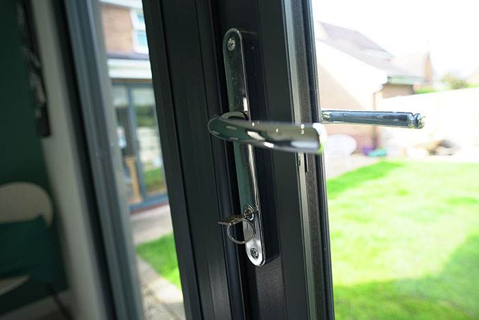 Stylish graphite PVC doors in modern garden room