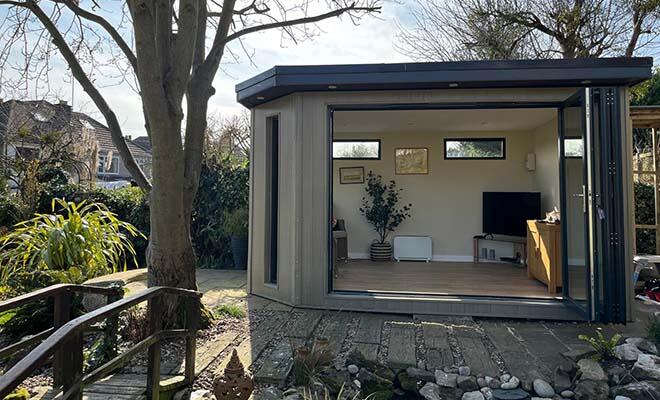 bespoke corner garden room with large bi fold doors and windows