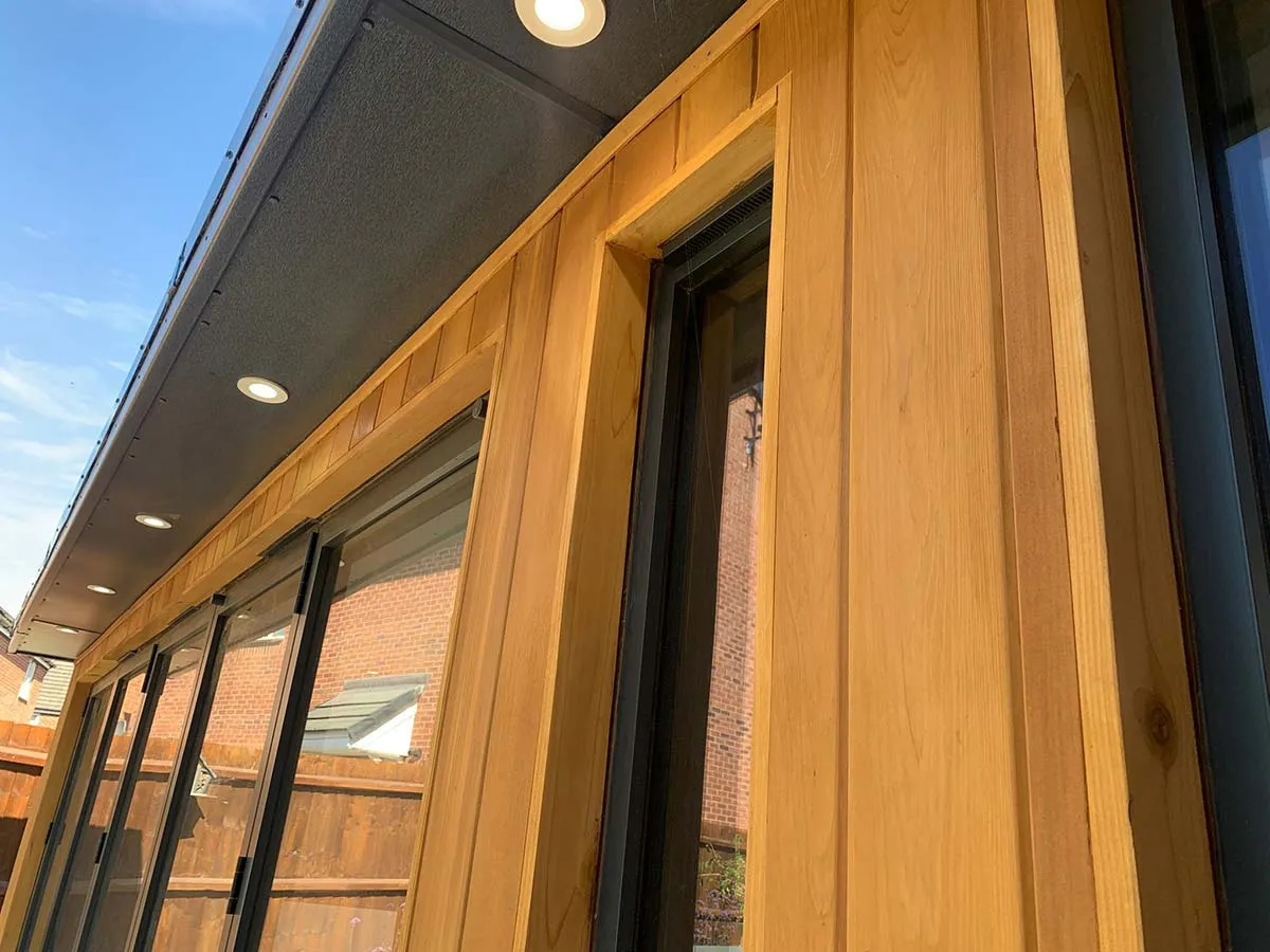detail of cladding for garden room in natural treated timber by dpm garden rooms